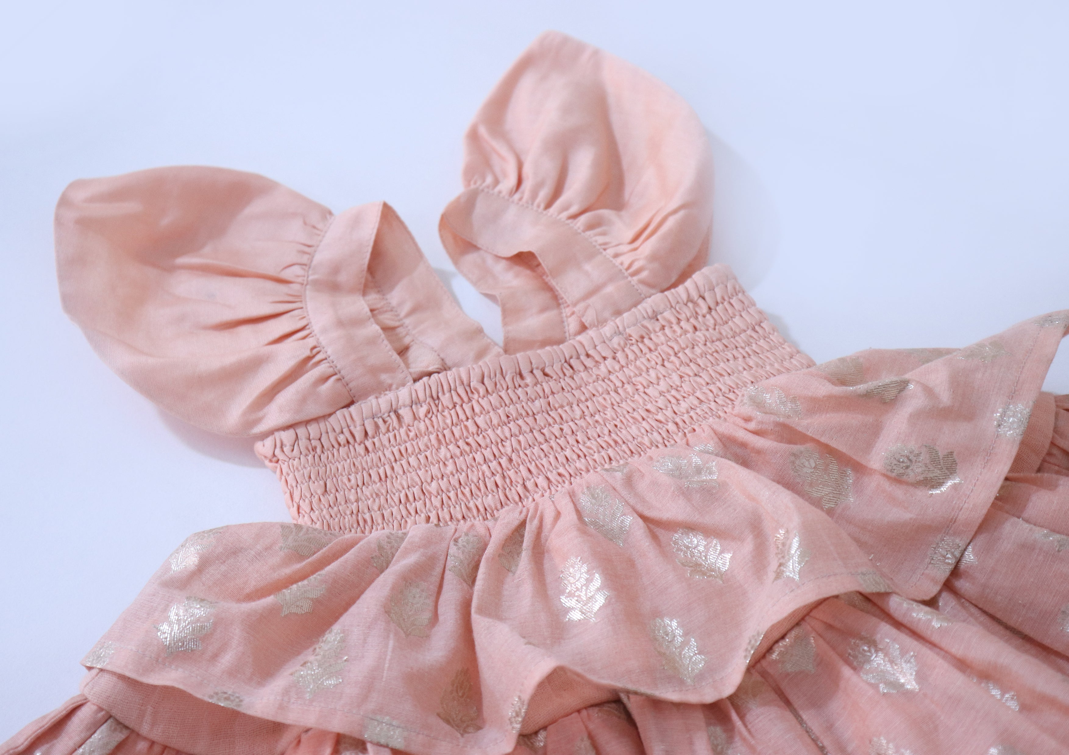 SnuggleMe Infant Girl Peach Smocking Frock with Zari Booti