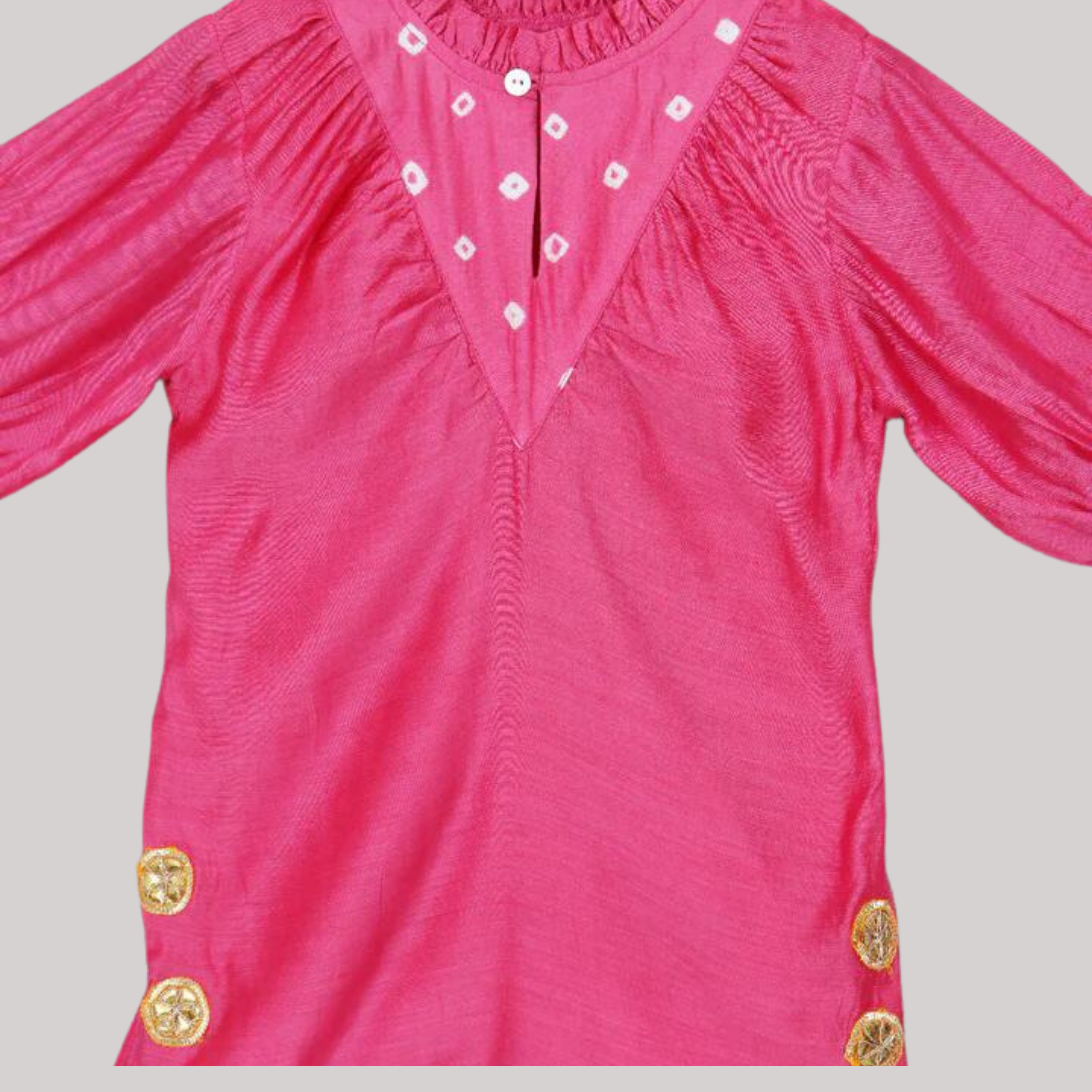 Little girl in a pink ethnic dress adorned with gota flowers and laces