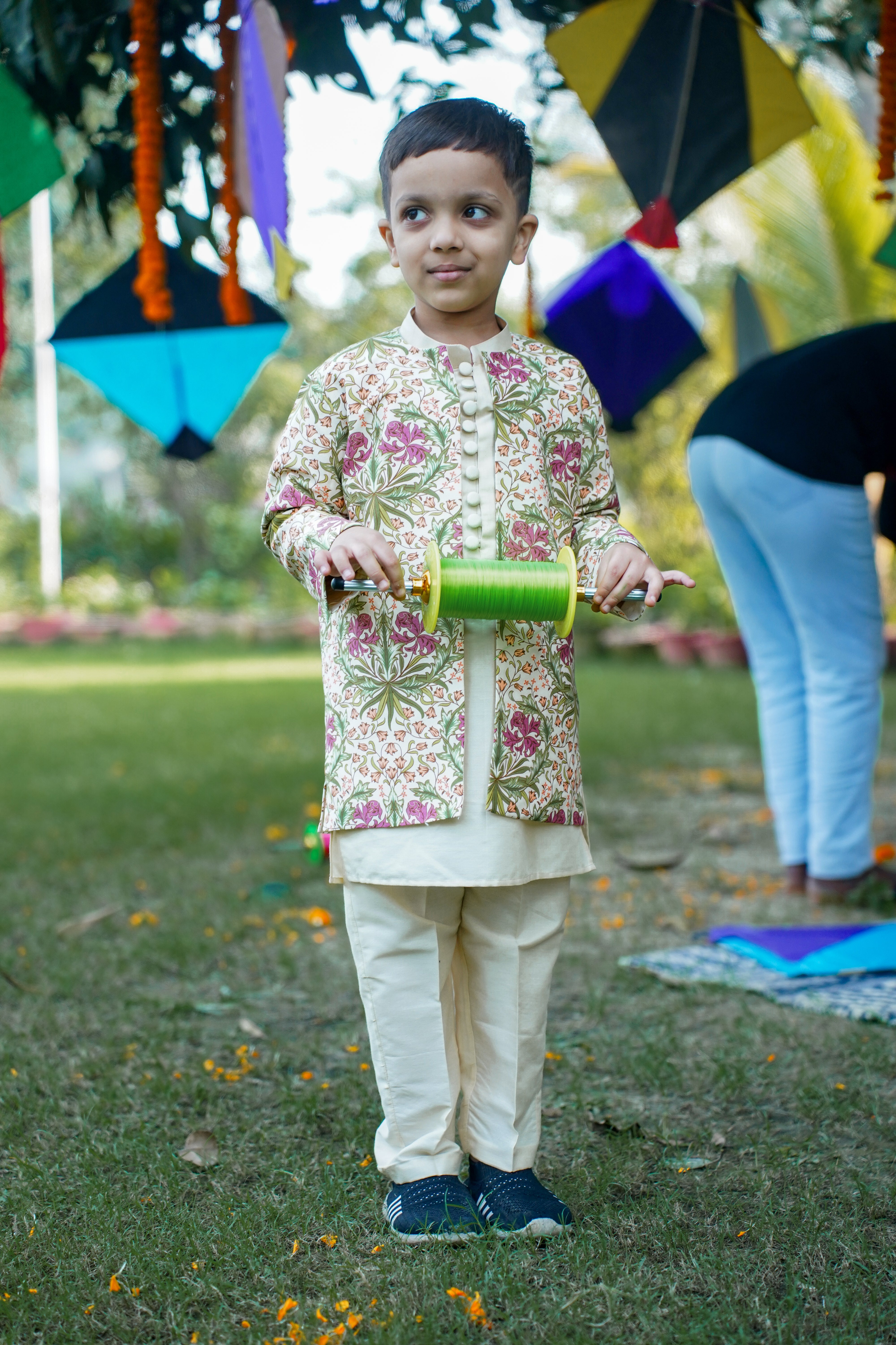 SnuggleMe Boys' ethnic set with beige kurta, comfortable pants, and printed yellow jacket, fusing traditional style with modern flair
