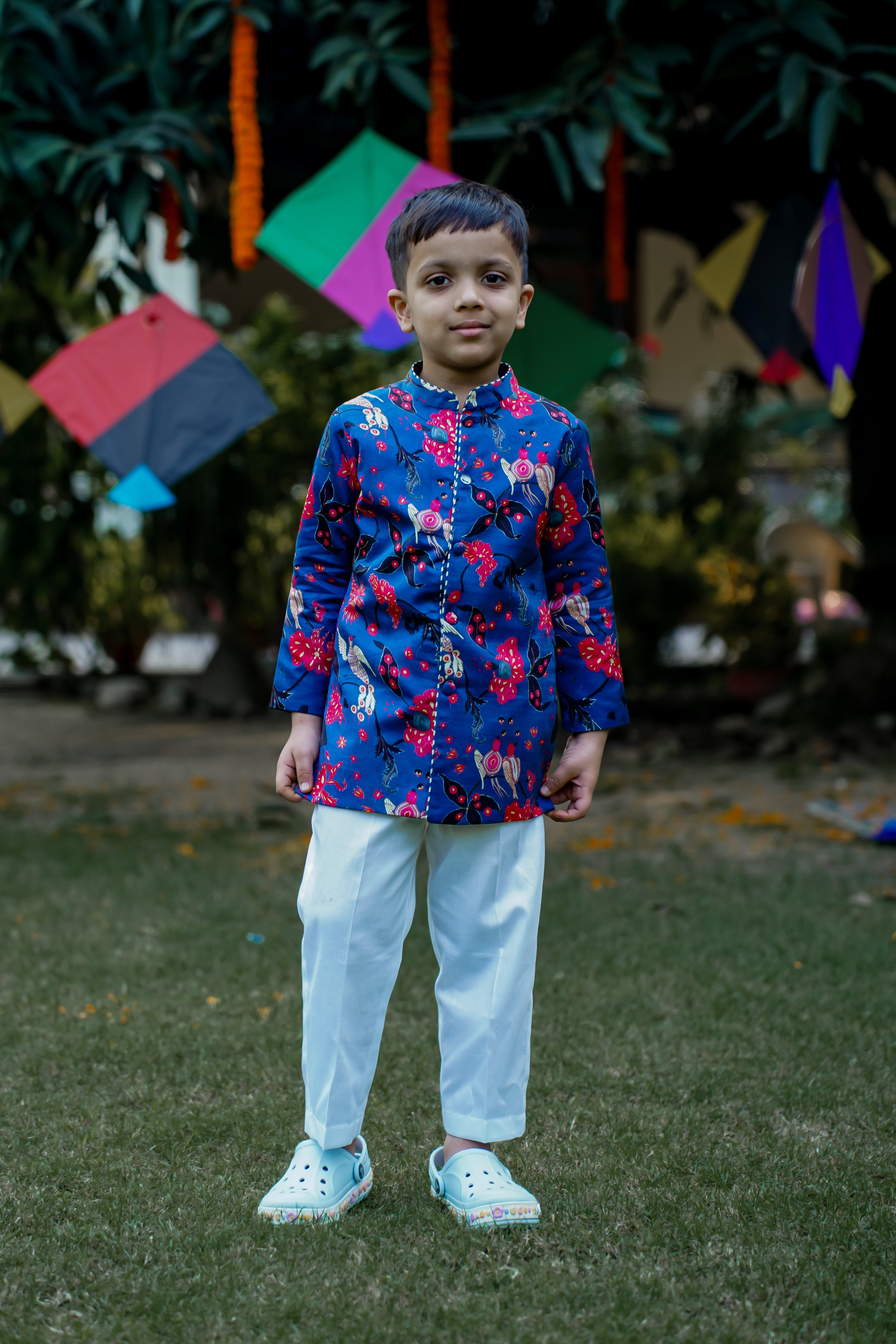 SnuggleMe boys' vibrant blue short sherwani in satin silk with white cotton trousers, perfect for weddings and festive occasions.