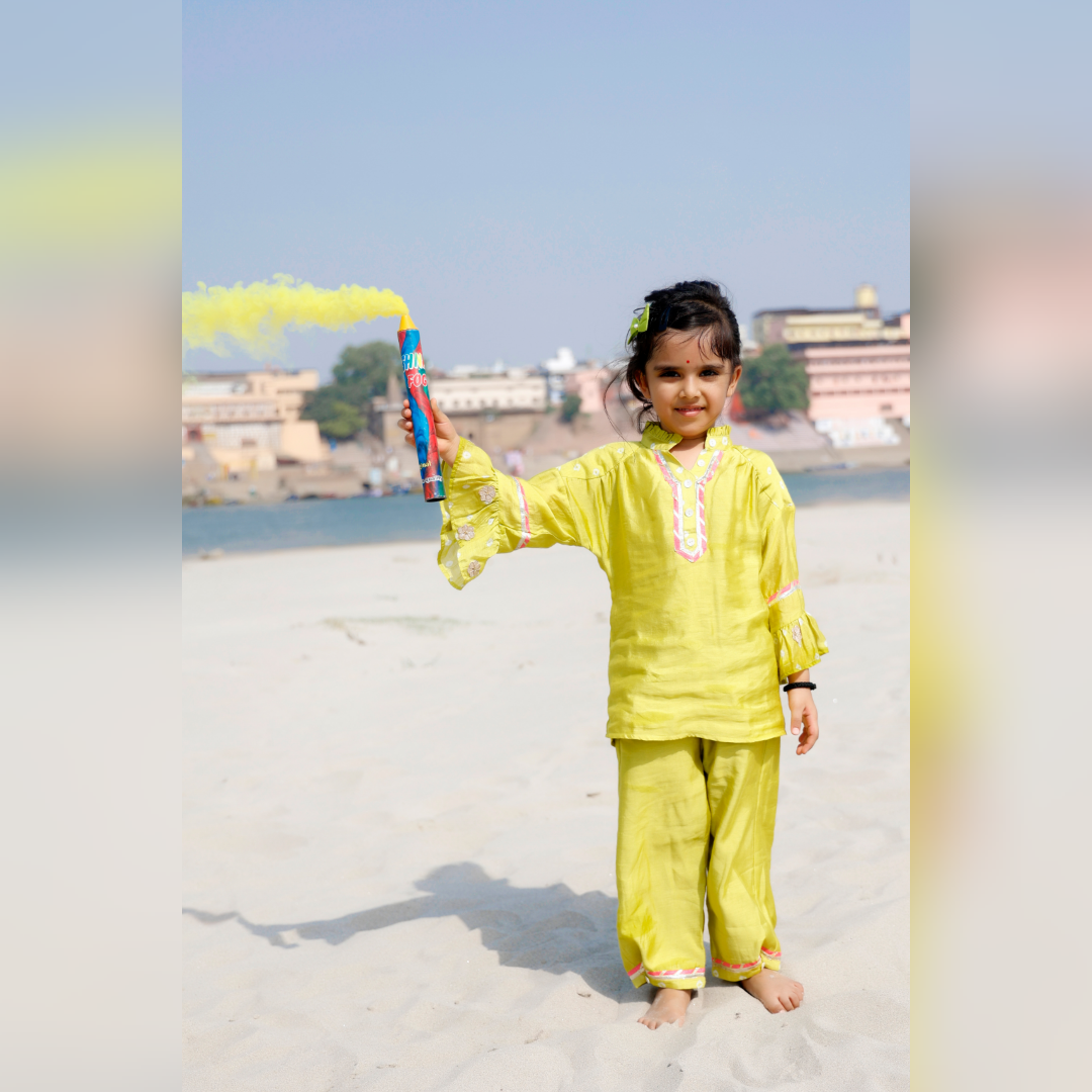 Little girl in a lime green vintage-inspired ethnic set