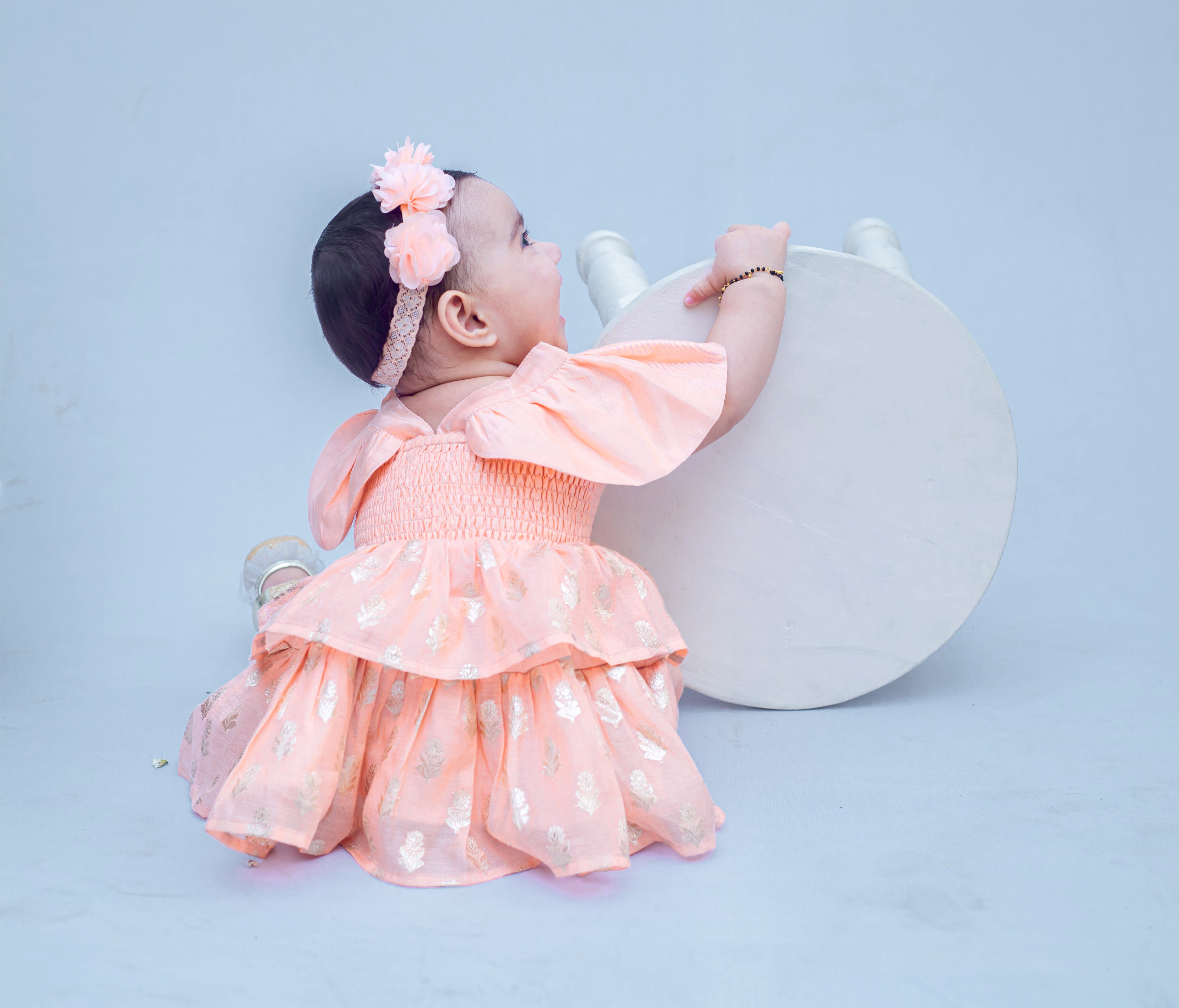 SnuggleMe Infant Girl Peach Smocking Frock with Zari Booti